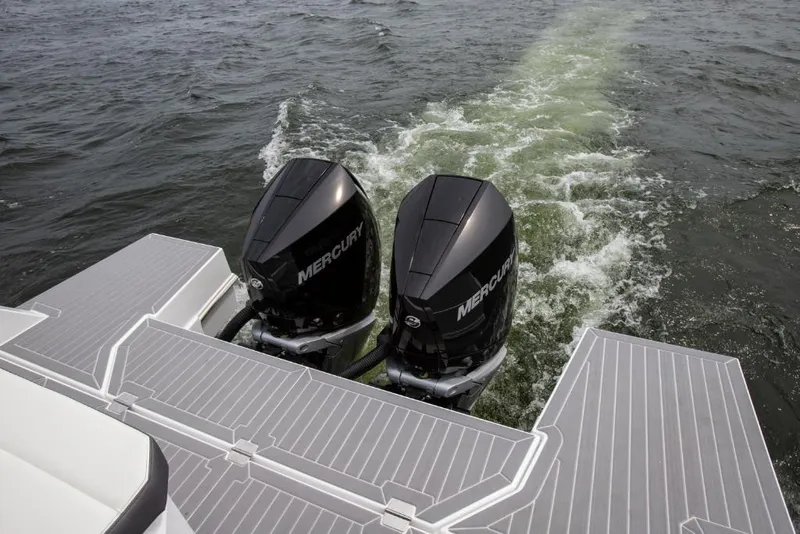 Slide: The Image of 2023 Cruisers Yachts 34 GLS I/O with twin Mercury outboard engines on water. - 30