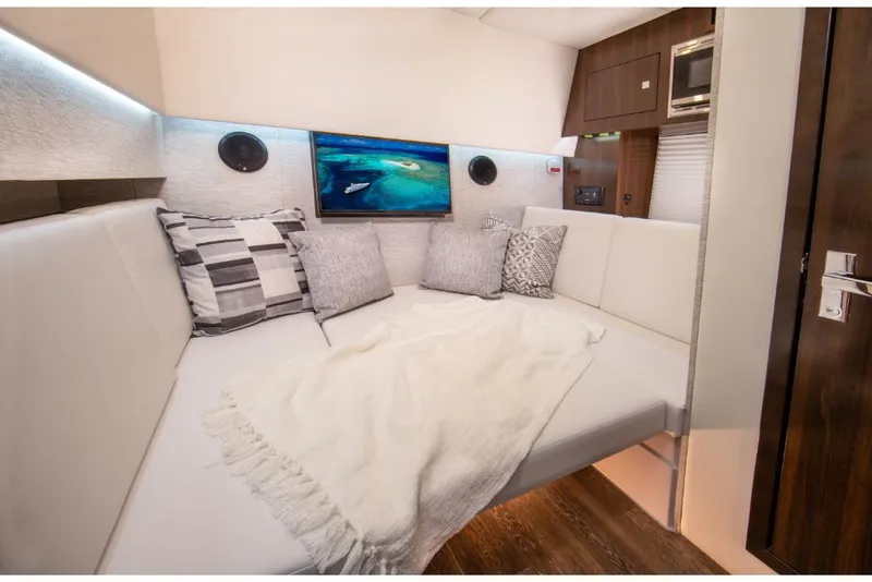 Slide: The Image of Luxurious interior of 2023 Cruisers Yachts 34 GLS I/O with cozy seating and modern amenities. - 34