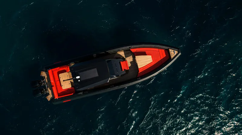 Slide: The Image of Aerial view of 2024 Skipper-BSK 38NC boat cruising on dark blue water. - 1