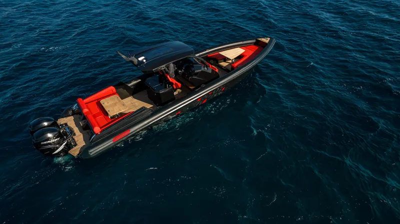Slide: The Image of 2024 Skipper-BSK 38NC luxury boat cruising on open water. - 5