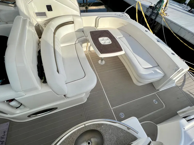 Slide: The Image of 2007 Sea Ray 40 Sundancer yacht with spacious white leather seating and table. - 10