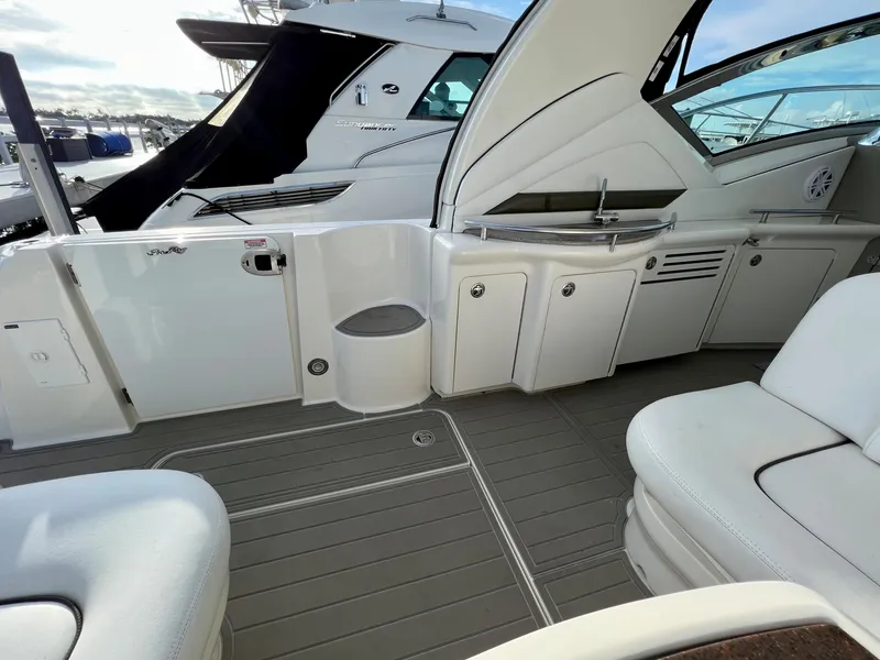 Slide: The Image of 2007 Sea Ray 40 Sundancer yacht interior with seating and kitchenette. - 11