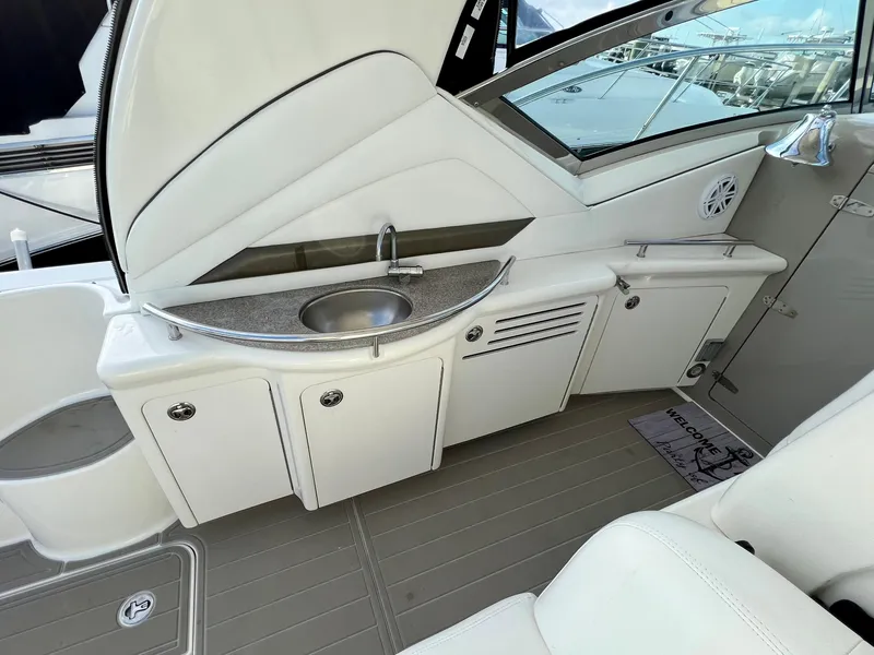 Slide: The Image of 2007 Sea Ray 40 Sundancer yacht kitchenette with sink and storage cabinets. - 12