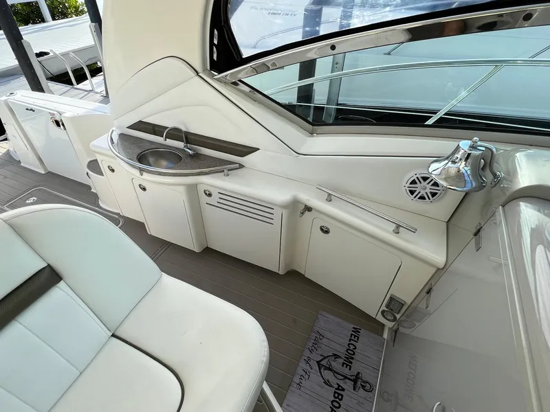 Slide: The Image of Interior of 2007 Sea Ray 40 Sundancer yacht with sink and seating area. - 14