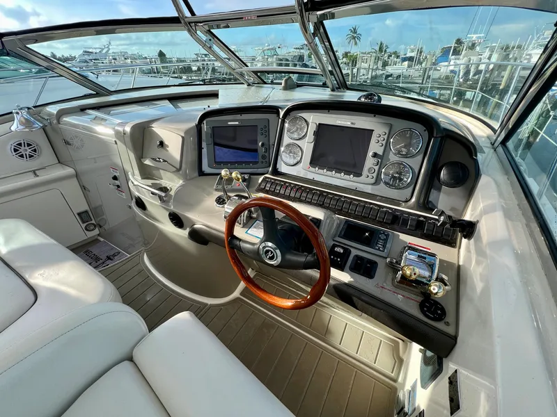 Slide: The Image of Cockpit of a 2007 Sea Ray 40 Sundancer yacht with modern navigation equipment. - 19