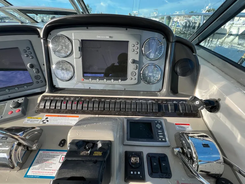 Slide: The Image of Control panel of a 2007 Sea Ray 40 Sundancer yacht with navigation instruments. - 21