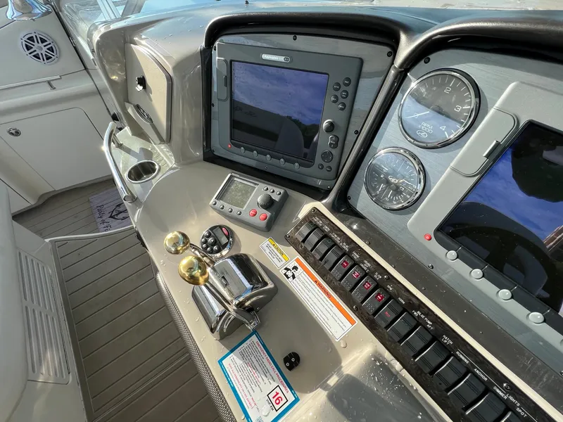 Slide: The Image of Control panel of a 2007 Sea Ray 40 Sundancer yacht with navigation instruments. - 22