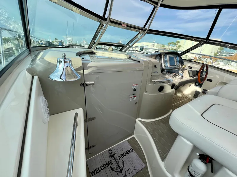 Slide: The Image of 2007 Sea Ray 40 Sundancer helm with modern controls and panoramic windows. - 23