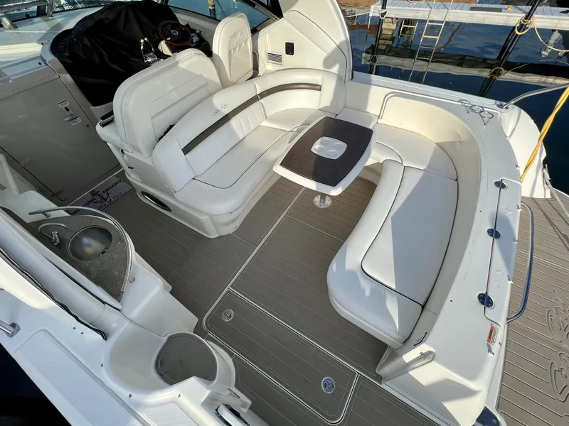 Slide: The Image of 2007 Sea Ray 40 Sundancer yacht interior with white seating and table. - 3