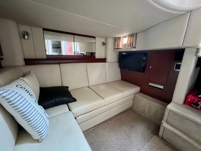 Slide: The Image of Interior of 2007 Sea Ray 40 Sundancer with beige leather seating and modern amenities. - 30