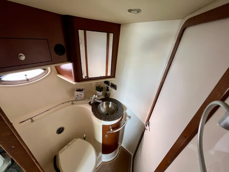 Slide: The Image of 2007 Sea Ray 40 Sundancer bathroom with sink, toilet, and mirror. - 34