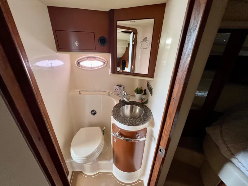 Slide: The Image of 2007 Sea Ray 40 Sundancer bathroom with sink, toilet, and mirror. - 35