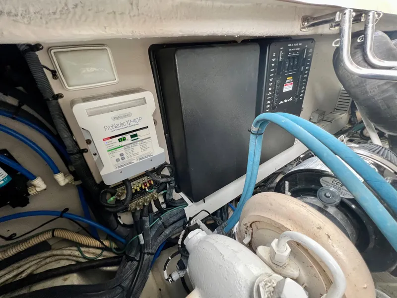 Slide: The Image of Engine compartment of a 2007 Sea Ray 40 Sundancer with electrical components and wiring. - 40