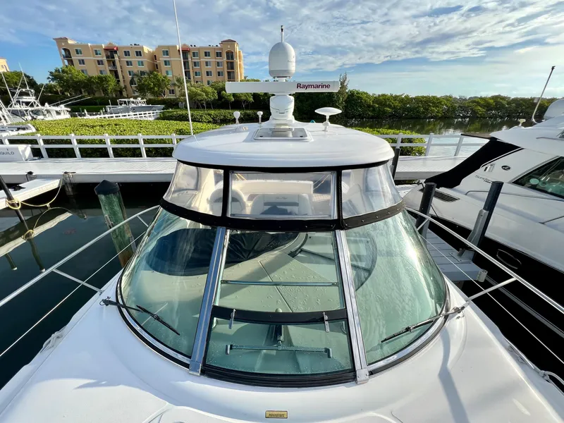 Slide: The Image of 2007 Sea Ray 40 Sundancer docked at marina with clear blue sky. - 8