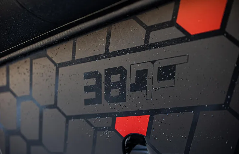 Slide: The Image of Skipper-BSK 38NC 2024 model with geometric design and water droplets. - 2