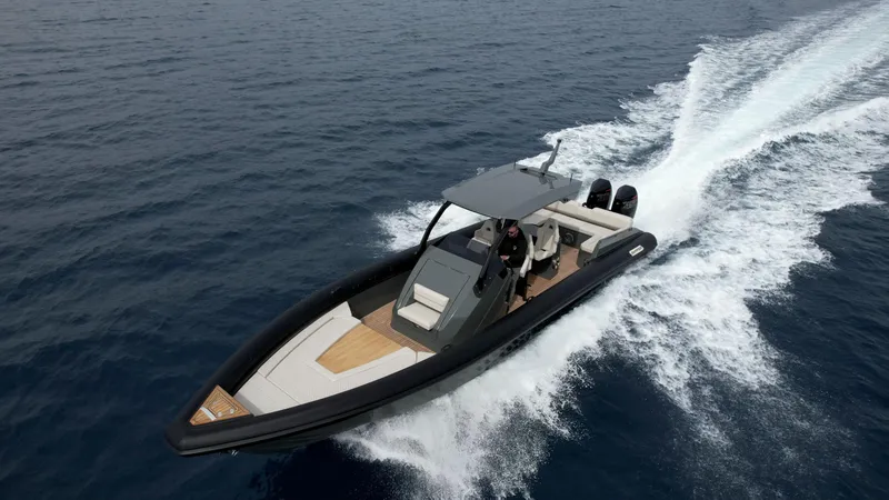Slide: The Image of 2024 Skipper-BSK 38NC speedboat cruising on open water. - 1