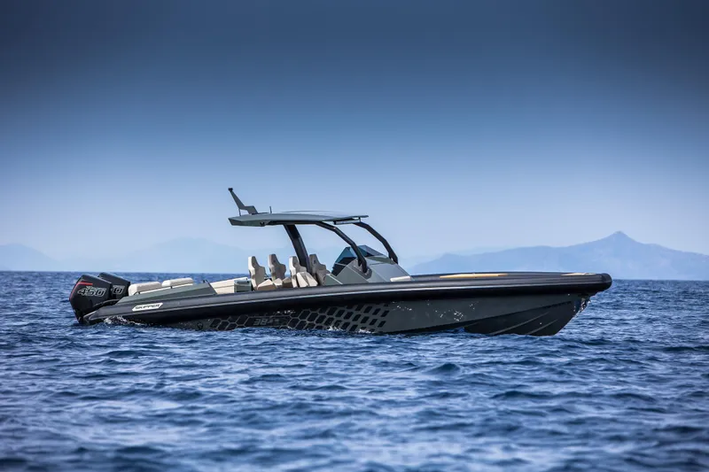 Slide: The Image of 2024 Skipper-BSK 38NC luxury boat cruising on open water. - 13