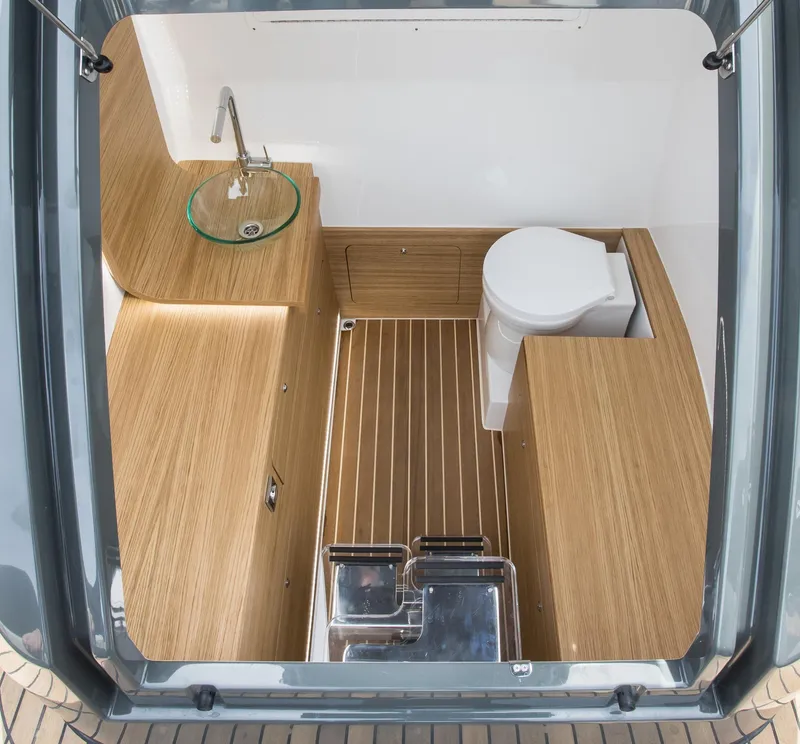 Slide: The Image of 2024 Skipper-BSK 38NC boat interior bathroom with wooden finish and modern fixtures. - 28