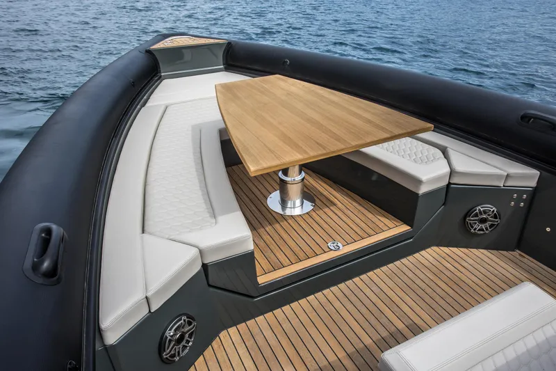 Slide: The Image of Luxurious seating area on the 2024 Skipper-BSK 38NC boat with a wooden table. - 48