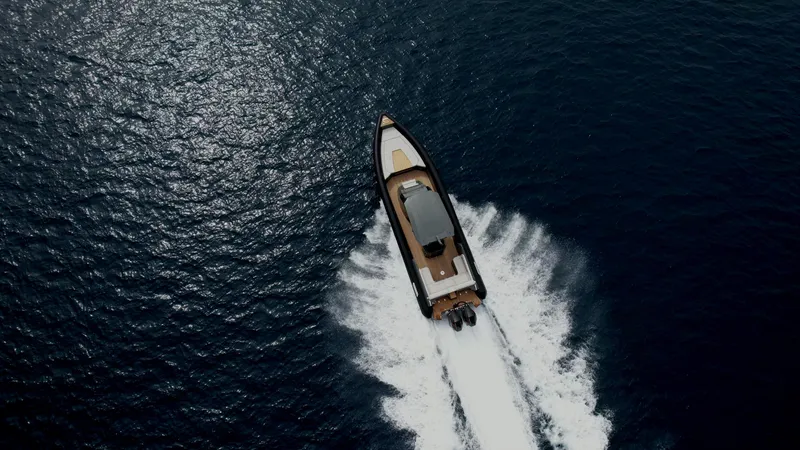 Slide: The Image of Aerial view of 2024 Skipper-BSK 38NC boat cruising on open water. - 6