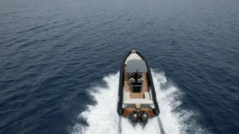 Slide: The Image of 2024 Skipper-BSK 38NC boat cruising on open water. - 2