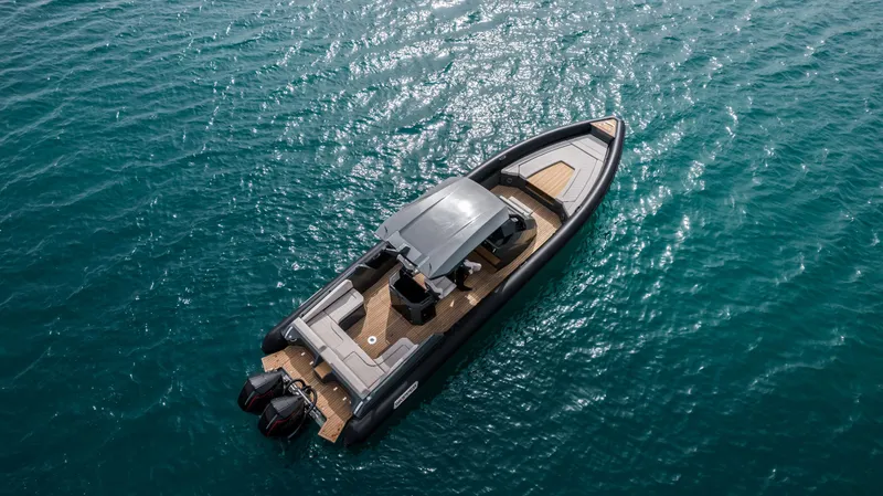 Slide: The Image of 2024 Skipper-BSK 38NC luxury boat cruising on open water. - 22