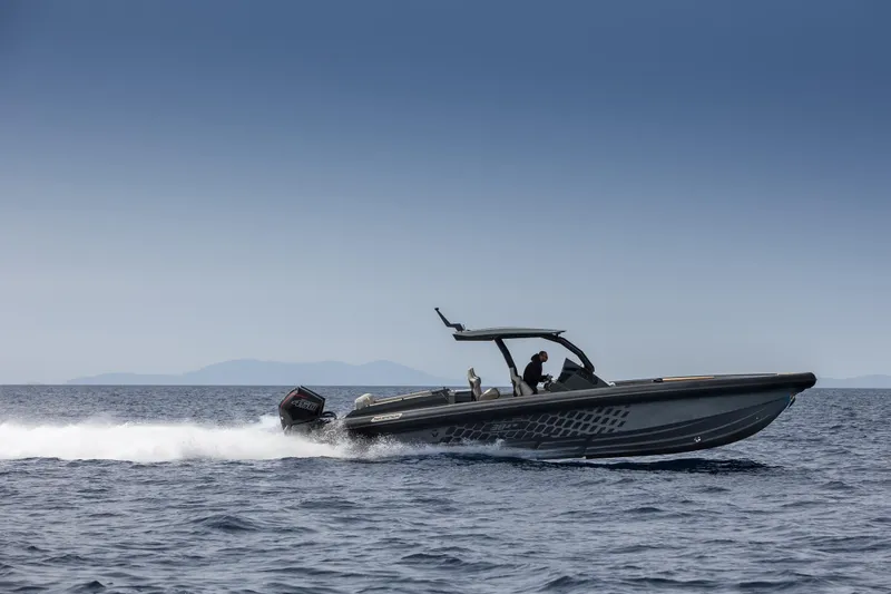 Slide: The Image of 2024 Skipper-BSK 38NC speedboat cruising on open water. - 7