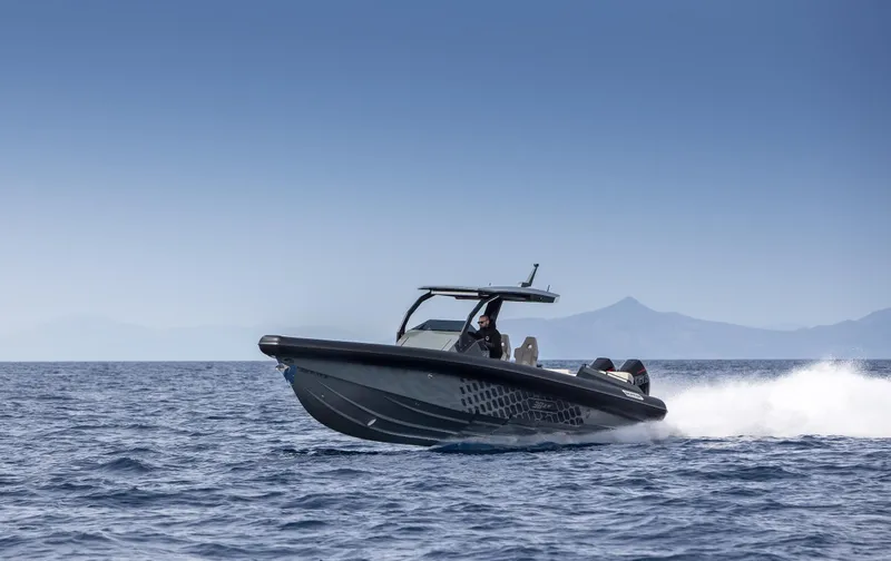 Slide: The Image of 2024 Skipper-BSK 38NC speedboat cruising on open water. - 8