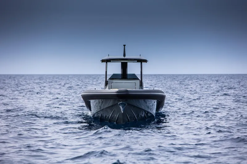 Slide: The Image of 2024 Skipper-BSK 38NC boat on open sea, front view. - 14