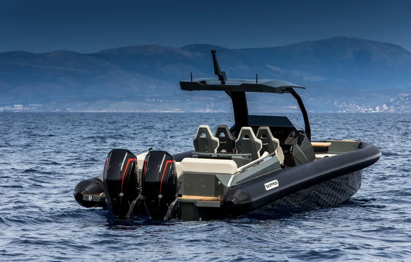 Slide: The Image of 2024 Skipper-BSK 38NC boat with dual outboard motors on open water. - 19