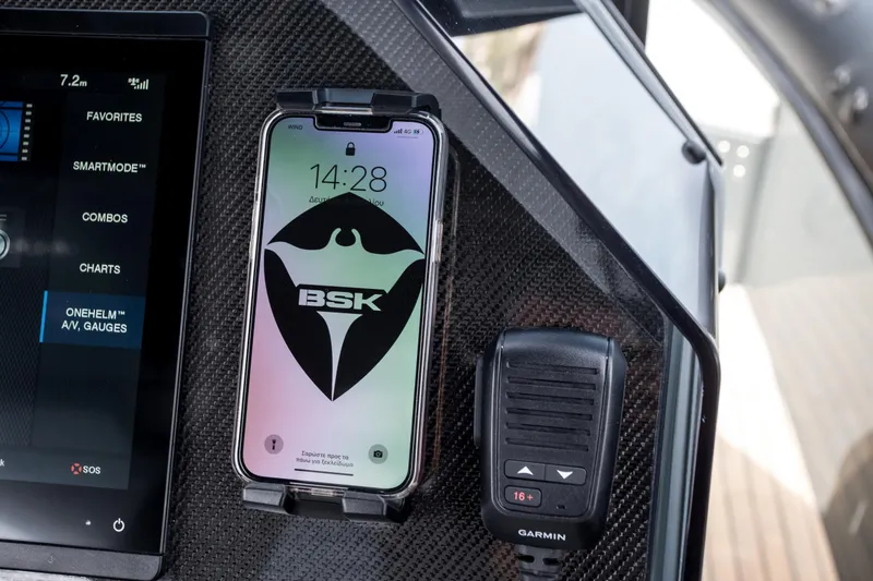 Slide: The Image of Skipper-BSK 38NC 2024 dashboard with smartphone and Garmin radio. - 36