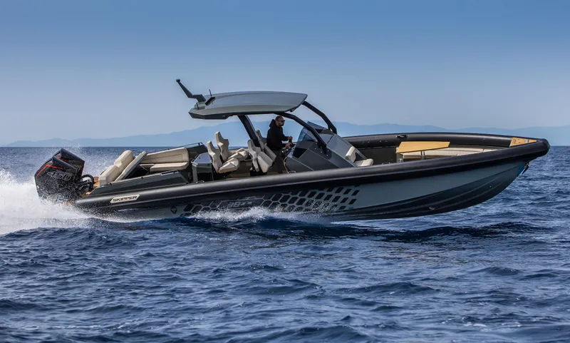 Slide: The Image of 2024 Skipper-BSK 38NC luxury speedboat cruising on open water. - 2
