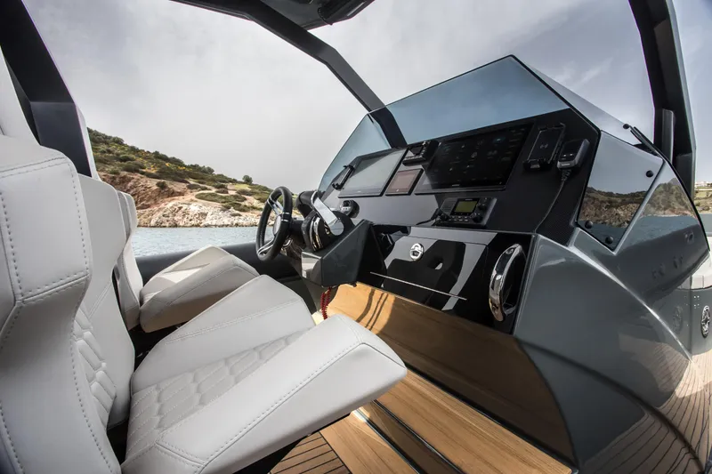 Slide: The Image of 2024 Skipper-BSK 38NC boat interior with white seats and modern dashboard. - 36