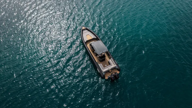 Slide: The Image of Aerial view of 2024 Skipper-BSK 38NC boat on clear blue water. - 18