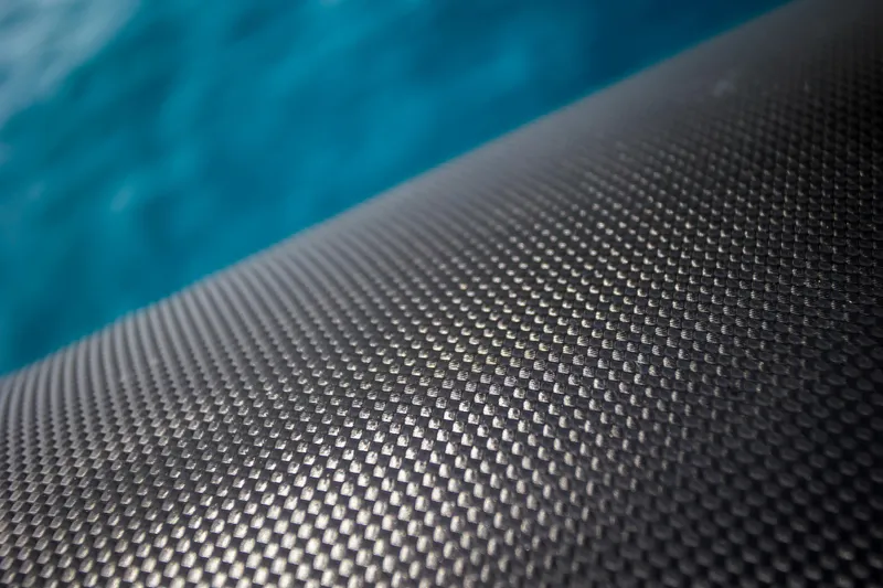 Slide: The Image of Close-up of Skipper-BSK 38NC 2024 boat's textured surface with blue water background. - 24