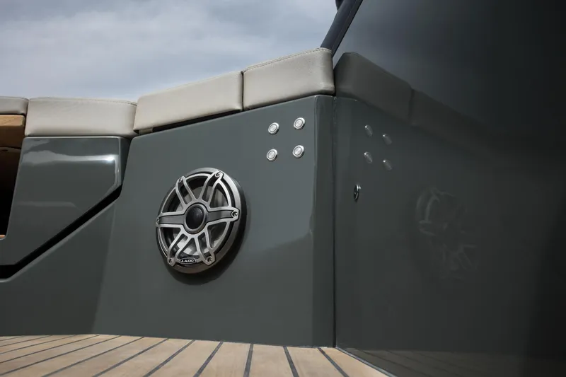 Slide: The Image of 2024 Skipper-BSK 38NC boat with cushioned seating and marine speaker. - 30