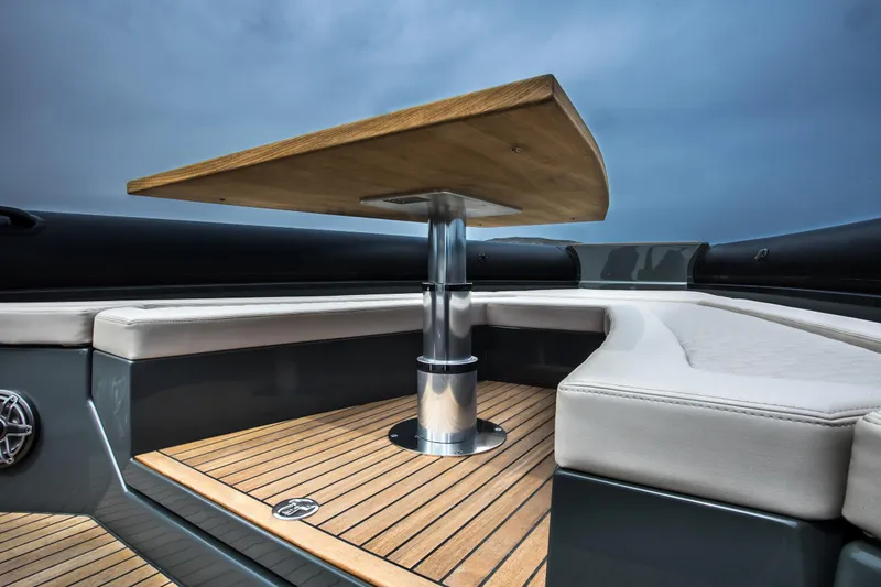 Slide: The Image of Luxury seating area on Skipper-BSK 38NC 2024 boat with wooden table. - 48