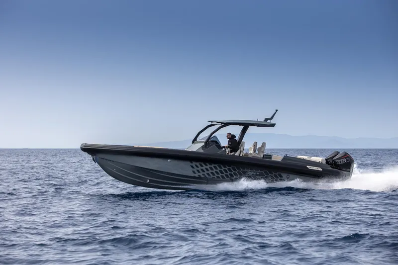 Slide: The Image of 2024 Skipper-BSK 38NC speedboat cruising on open water. - 11