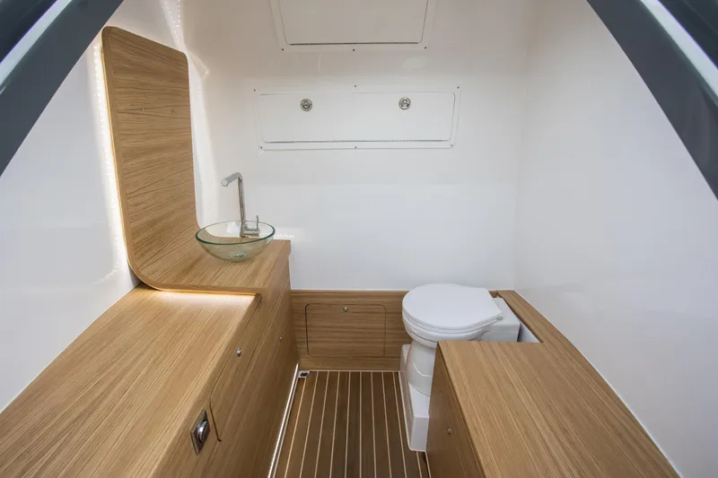 Slide: The Image of Modern bathroom in 2024 Skipper-BSK 38NC boat with wooden cabinetry and glass sink. - 28