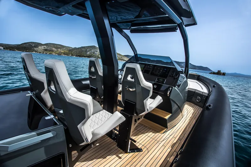 Slide: The Image of 2024 Skipper-BSK 38NC boat interior with modern seating and control panel. - 44