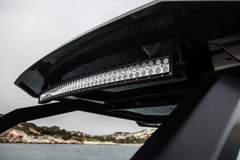 Slide: The Image of 2024 Skipper-BSK 38NC boat with LED light bar, coastal background. - 48