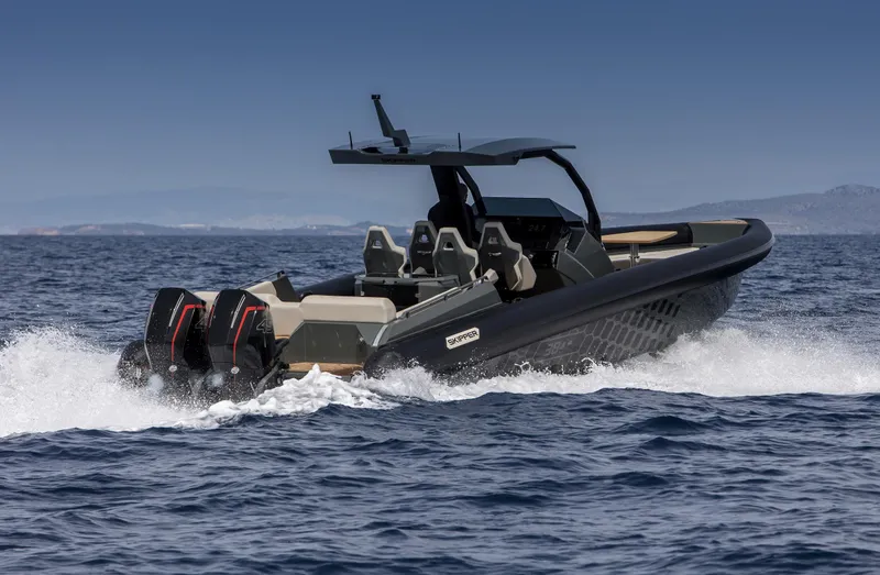 Slide: The Image of 2024 Skipper-BSK 38NC boat cruising on open water. - 6