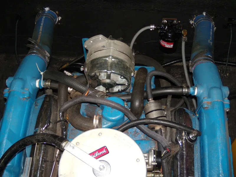 Slide: The Image of 1970 Century Mark II engine with blue components and Edelbrock air filter. - 13