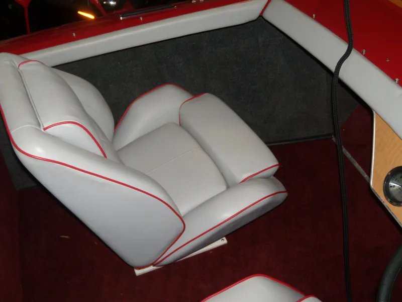 Slide: The Image of 1970 Century Mark II boat interior with white and red-trimmed seats. - 8
