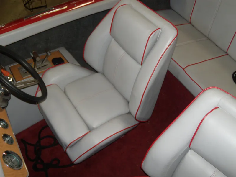 Slide: The Image of 1970 Century Mark II boat interior with white and red-trimmed seats. - 9