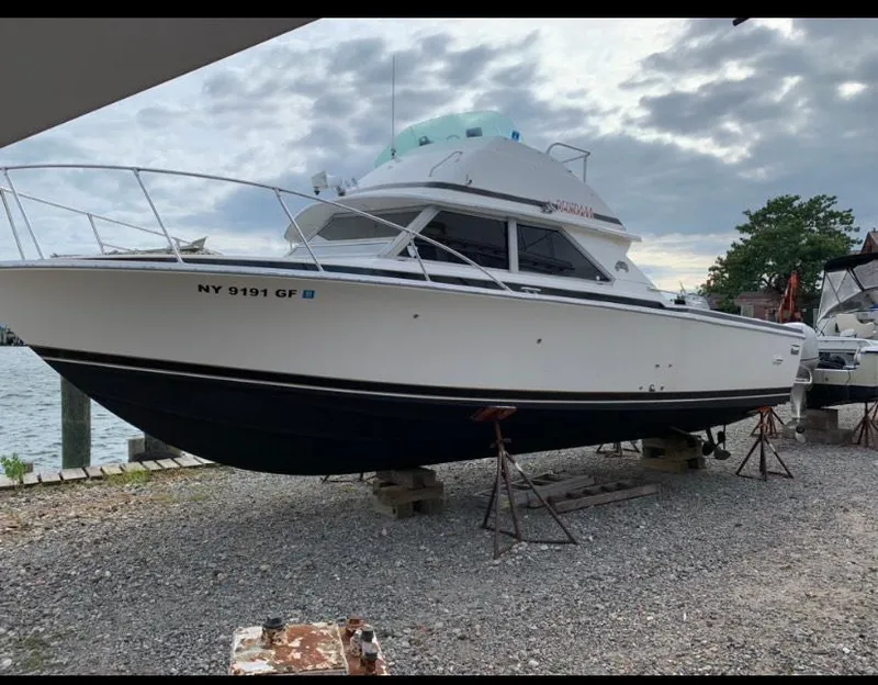 The Image of 1983 Bertram 28 FB boat on dry dock with NY 9191 GF registration. - 1
