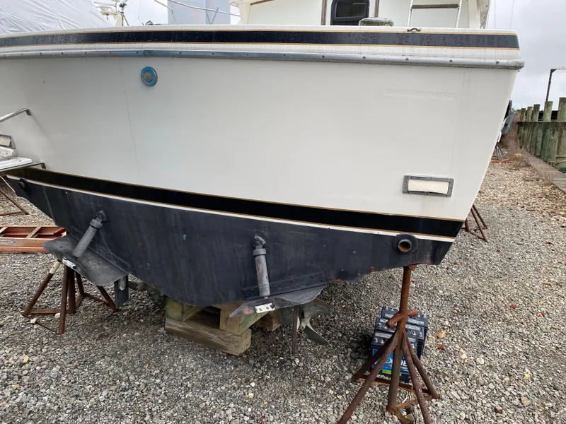 Slide: The Image of 1983 Bertram 28 FB boat on stands for maintenance. - 14