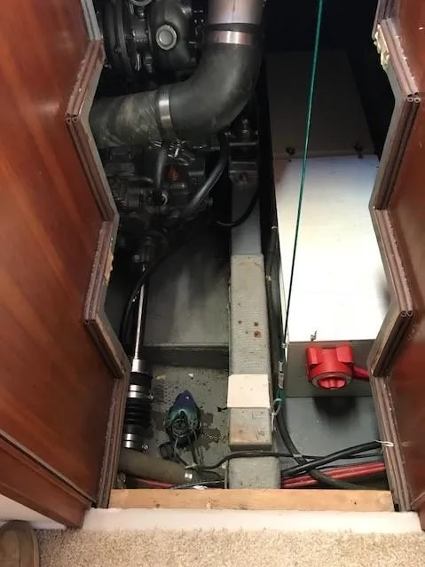 Slide: The Image of Engine compartment of a 1987 Tollycraft Sundecker Diesel boat, showing mechanical components. - 10