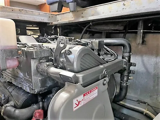 Slide: The Image of Engine compartment of a 1987 Tollycraft Sundecker Diesel boat, showcasing mechanical components. - 31