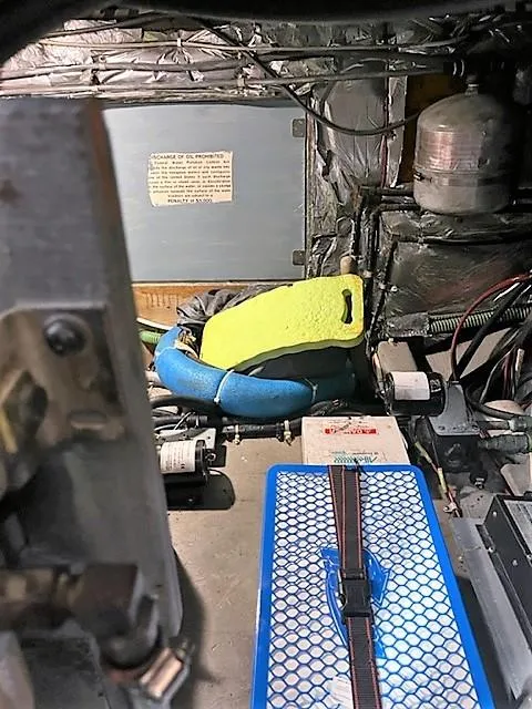 Slide: The Image of Engine room of 1987 Tollycraft Sundecker Diesel with safety equipment and wiring. - 35